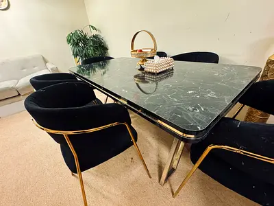 Black velvet dining chairs with gold legs and black marble-top dining table (6 chairs)