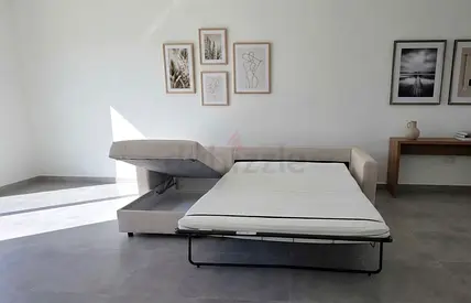 Stylish L-shaped sofa bed with a smooth pull-out mechanism, spacious sleeping surface, and useful h