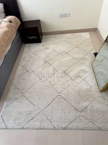 Light beige geometric area rug - good condition