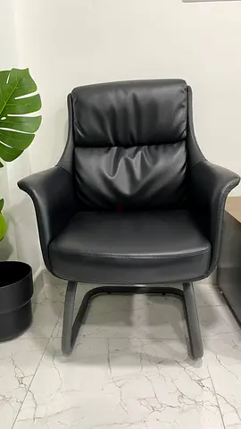 Black leather lounge armchair — comfortable single seat