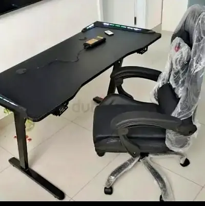 Black gaming/office desk with ergonomic swivel chair - good condition