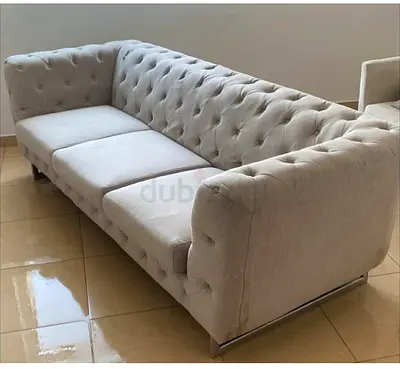 Light grey tufted 3-seater sofa in good condition