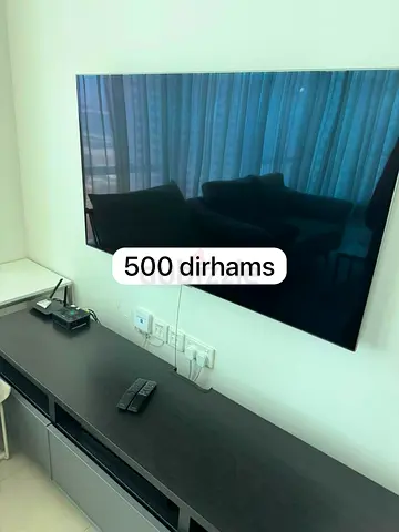 42-55 inch Wall-Mounted LED TV - Good Working Condition, 500 AED