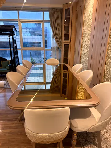 Modern wooden dining table with 8 upholstered chairs - excellent condition