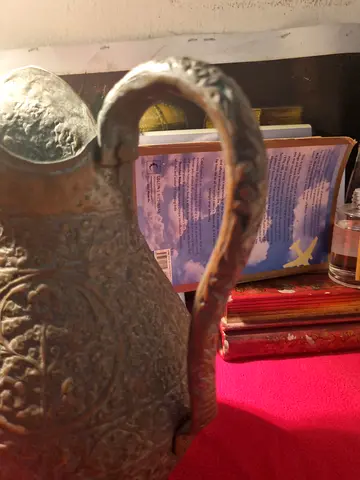 Antique decorative brass jug with ornate handle - vintage collectible