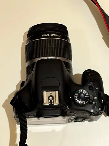 Canon DSLR with Standard Zoom Lens (used, working, comes with charger , very good condition)