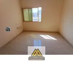 Annual 1BR apartment in Al Rashidiya 3, master room, 2 bathrooms, central AC, spacious layout, AED