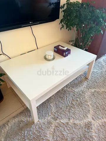 White modern coffee table with lower shelf - good condition