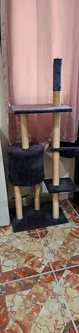 Used multi-level cat tree with scratching posts and condo