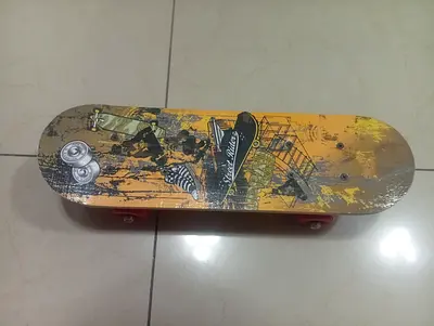 Graphic kids skateboard with red wheels