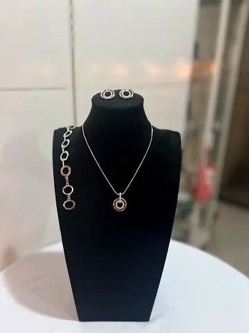 Swaroski! Silver circular pendant necklace with matching bracelet and stud earrings set