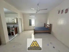 Annual studio in Al Nakheel 1, spacious, separate kitchen, split AC, free maintenance, 2nd row from