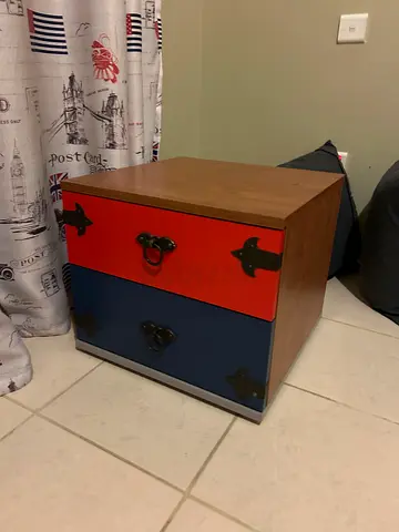 Modern Wooden Nightstand with Red and Blue Drawers