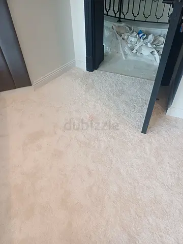 Cream fitted wall-to-wall carpet — good condition
