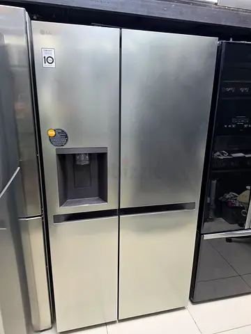 LG Stainless Steel Side-by-Side Refrigerator with Water Dispenser - Good Condition