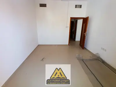 Annual 1BR apartment in Al Rashidiya 3, balcony, central AC, spacious layout, prime location, AED 28,999, 4 cheques.