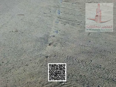 Land for sale in Masfout 8, suitable for a rest house. Area: 4596 sq ft. Permit: Ground + 1. Excellent location on a main road. Asking price: 220,000.