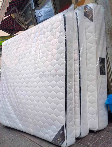 Brand new queen-size mattress - firm comfort, still wrapped