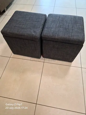 Pair of grey fabric ottoman cubes - compact seating/storage