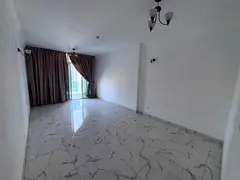 2BR apartment in Al Waha Towers Ajman with sea view, balcony, parking and spacious layout.