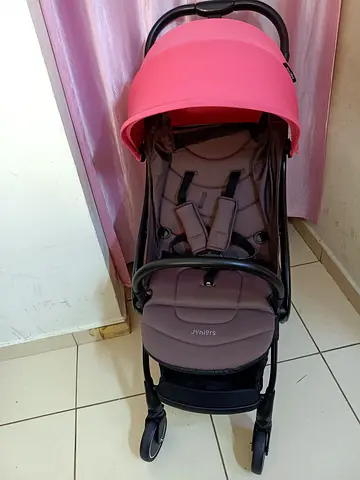 Lightweight baby stroller/pram with pink canopy — good condition location - Dubai Al QUSAIS