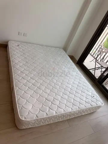 Queen-size mattress in good condition, firm support