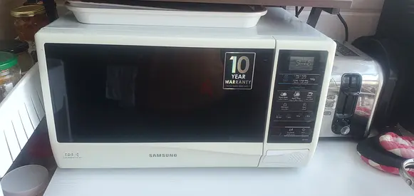 Samsung 23L Microwave Oven with 10-Year Warranty Sticker - Good working Condition