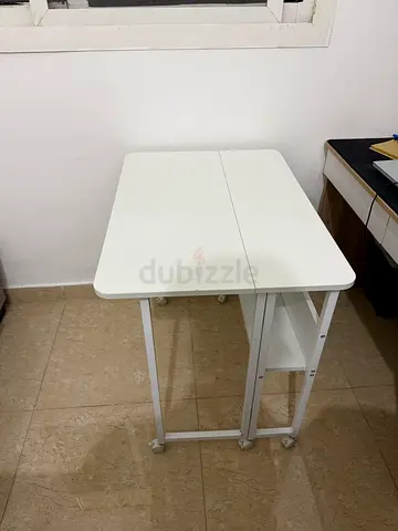Slim foldable white kitchen island/cart on wheels - compact space saver