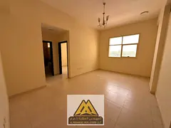 Two-bedroom apartment with a living room and two bathrooms (no balcony) for annual rent in Al Jurf 2