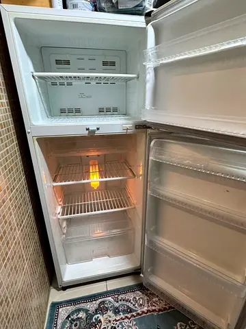 Used two-door refrigerator with freezer — good working condition