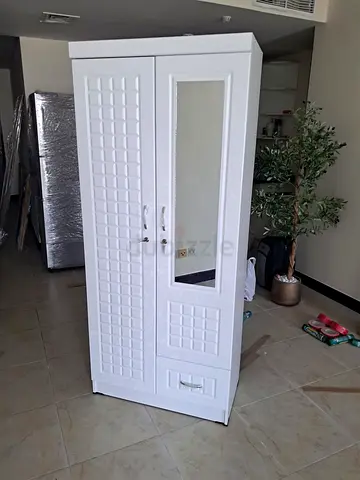 I am selling brand new 2 door wood cabinet good quality
