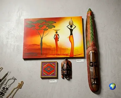 African-style wall art set — painting, carved mask and wooden tribal mask