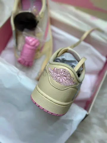 Worn-once Air Jordan low-top sneakers in cream  pink