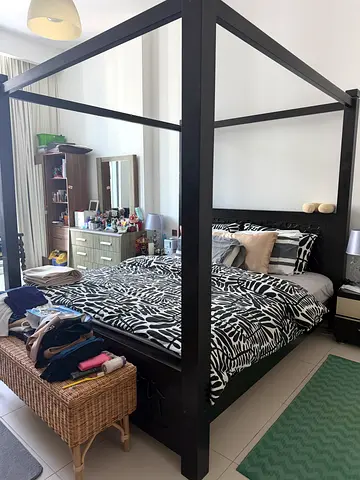 Black four-poster bed frame with storage drawers - king size