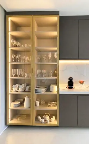 Tall Glass Display Cabinet with Gold Frame and Integrated Lighting