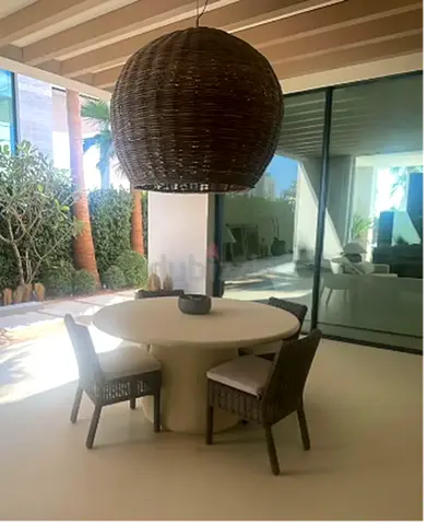 Modern Outdoor Dining Set with Round Table and Woven Chairs