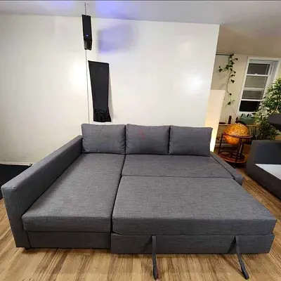 Grey L-shaped Sofa Bed with Pull-out Ottoman - Good Condition