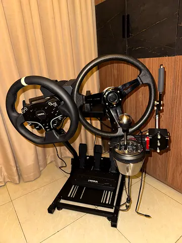 Used racing wheel and pedal setup with Moza R5 steering wheel stands and force feedback base