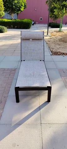 Outdoor sun lounger with adjustable backrest — beige fabric, metal frame