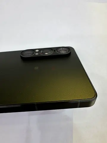Mid-range smartphone with triple rear cameras - good condition