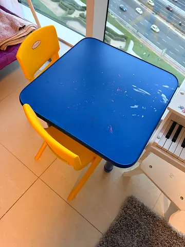 Kids table with two yellow chairs - used, good for playroom
