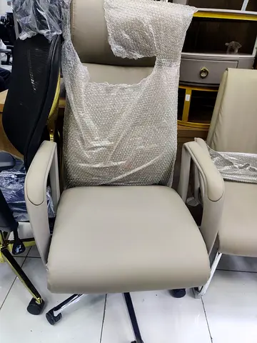 Cream ergonomic office chair with footrest - good condition