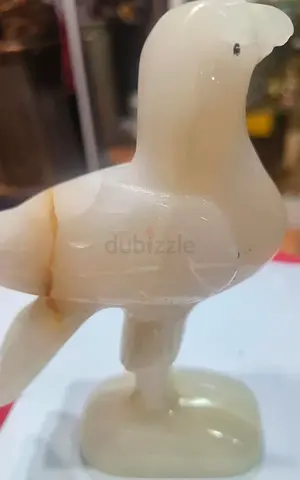 White stone bird figurine on pedestal 13cm height