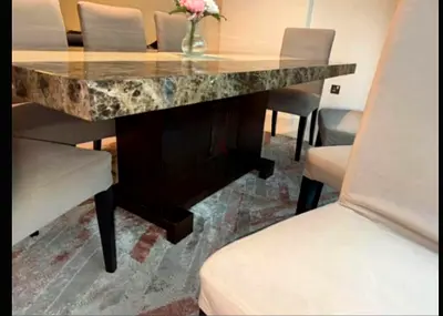 Marble-top dining table with 8 upholstered chairs - good condition