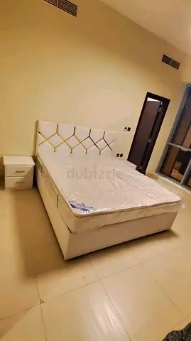 White upholstered queen bed