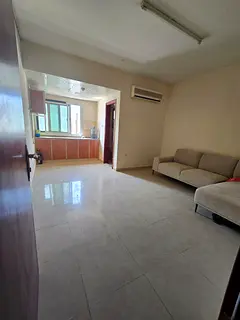 Spacious studio for rent in Muweilah with a semi-separate kitchen, ideally located behind the school