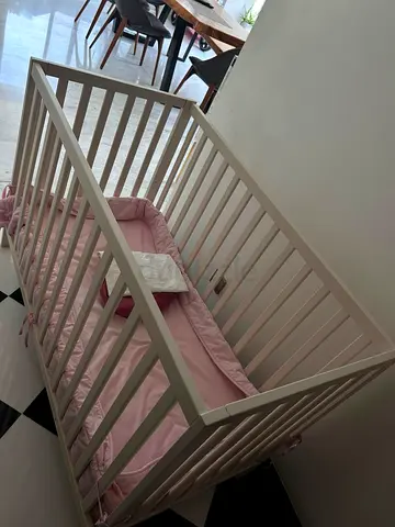 White Wooden Baby Crib with Pink Bedding - Good Condition