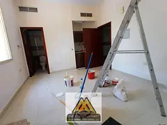Studio for annual rent in Al Rashidiya 3, Ajman. Large space, semi-separated kitchen, good finishing