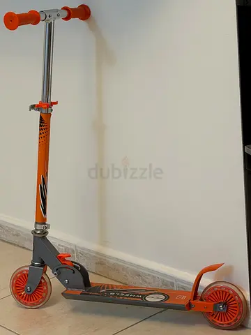 Orange three-wheel kids scooter - adjustable handlebar, good condition