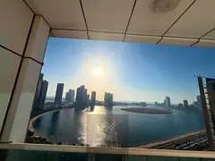 Stunning 3-bedroom apartment with a living room in Sharjah, featuring a full sea view and a balcony.